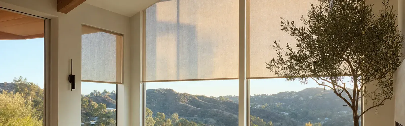 Light-filtering roller shades in a warm residential living room